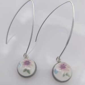 Accueil boucles fleurs grands crochets